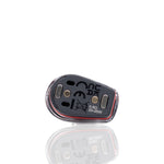 A small black vape battery or pod device with white printed specifications and symbols, shown on a clean white background with a soft reflection below.