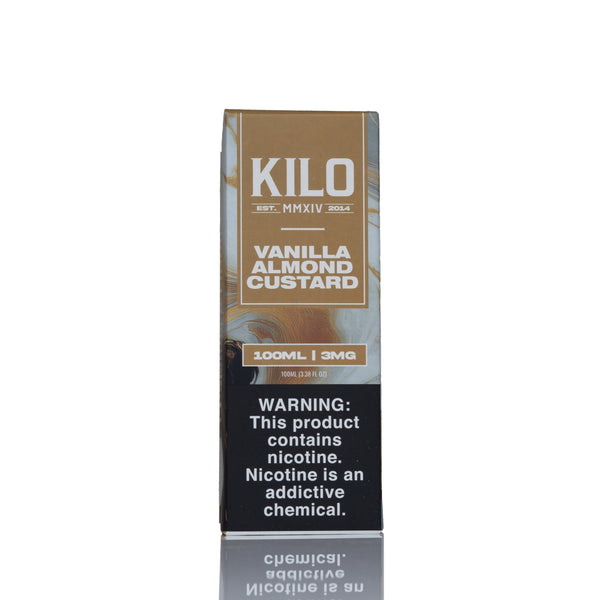 A tall rectangular box of Kilo Vanilla Almond Custard e-liquid, 100ml, 3mg. The packaging features a brown and beige top half with white text, and a black warning label on the bottom half.