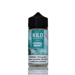 A 100ml bottle of Kilo Cool Mint e-liquid with a black cap and a teal and white label, shown on a white background with a reflection below.