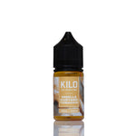 A 10ml bottle of Kilo Vanilla Custard Tobacco e-liquid, featuring amber-colored liquid inside a clear bottle with a black childproof cap and a beige label, set against a plain white background with a soft reflection.