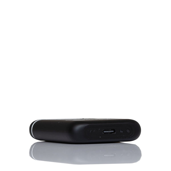 A black rectangular electronic device, shown from a side angle, featuring a USB-C port on its side, set against a plain white background with a soft reflection below.